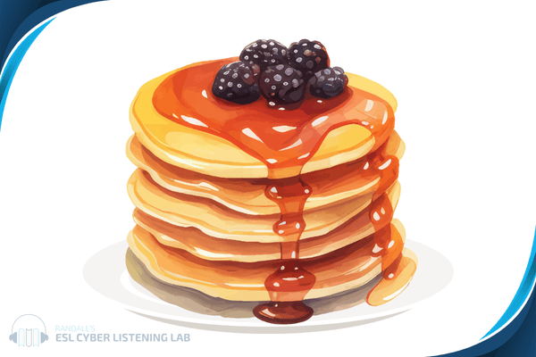 Stack of pancakes with berries and syrup on top.